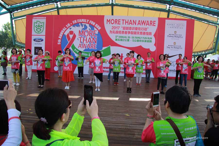 people in pink and green dancing